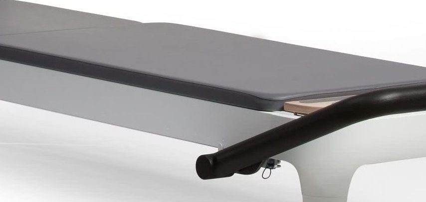 Storm color Pilates mat on reformer frame for stable exercise