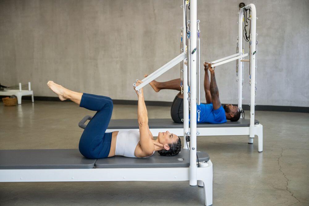 Pilates workout on Allegro 2 Tower of Power reformers