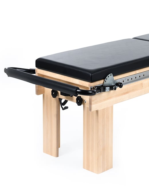 Pilates equipment frame with adjustable height and satin finish.