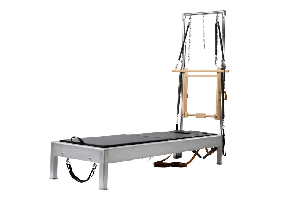 Contrology Reformer with Tower and Mat for Pilates training.