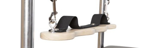 Pilates Cadillac accessory enhances training, supports feet and alignment.