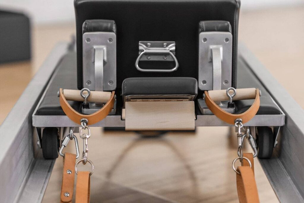 Contrology Box with leather straps and metal handles.