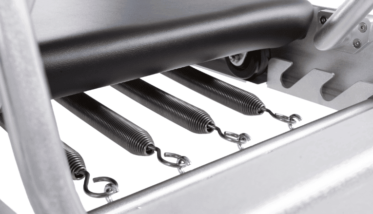 Contrology Springs on Pilates Reformer with open hooks.