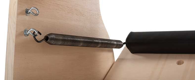 Close-up of classic Pilates chair spring attachment.