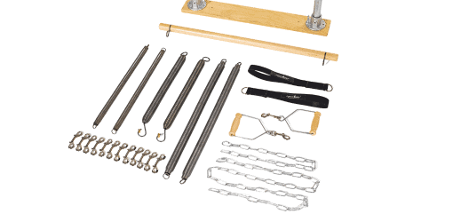 Pilates wall system with springs, bar, and accessories displayed.