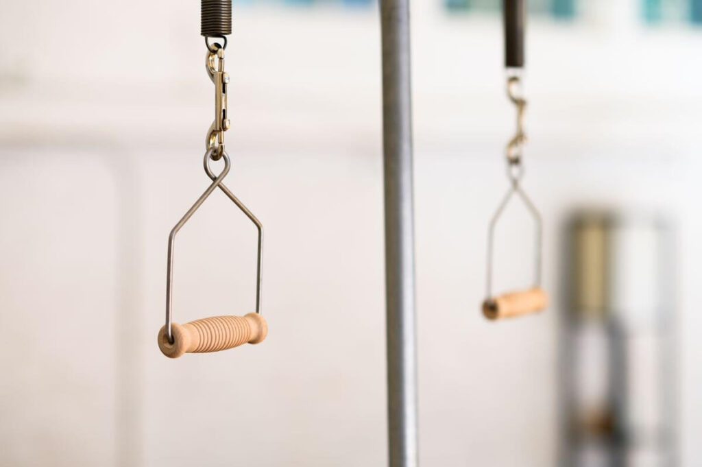 Contrology Wire Contoured Handles with wooden grips on Pilates equipment