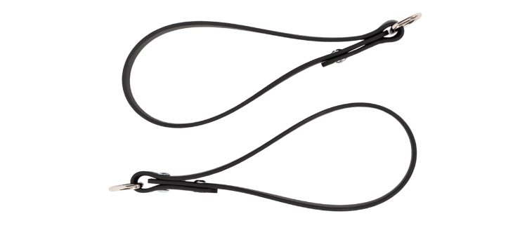 Black Pilates reformer straps with metal clips.