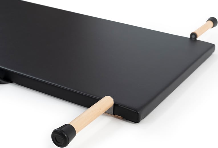 Professional Pilates mat with wooden frame and dowel handles