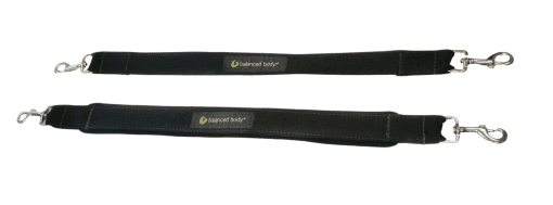 Pilates foot support straps with carabiners for reformer exercises.