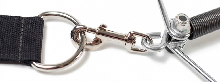 Close-up of Pilates equipment connector mechanism.