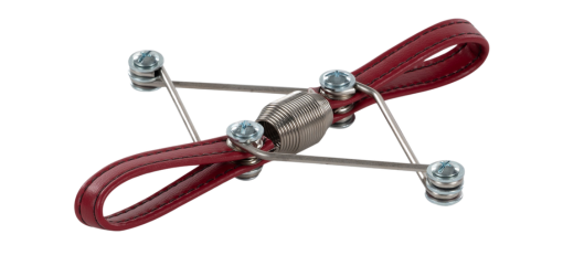 Compact Pilates accessory with non-corrosive metal and red leather loops.