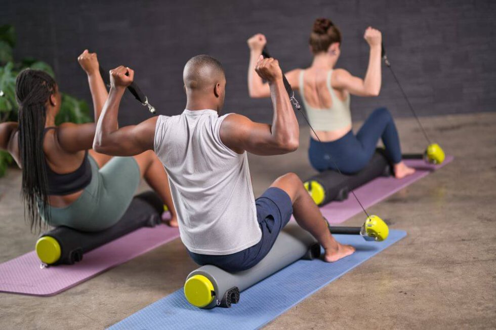 Pilates class using MOTR equipment for exercise