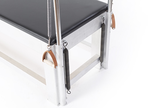 Balanced Body Pilates table with weld-free aluminum frame and black upholstery