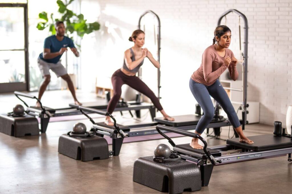 Pilates class using Allegro Standing Platform Extender.