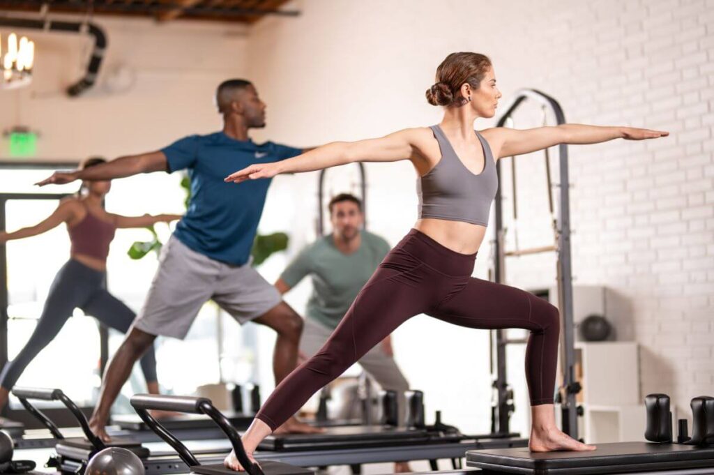 Pilates practitioners using Allegro Standing Platform Extender