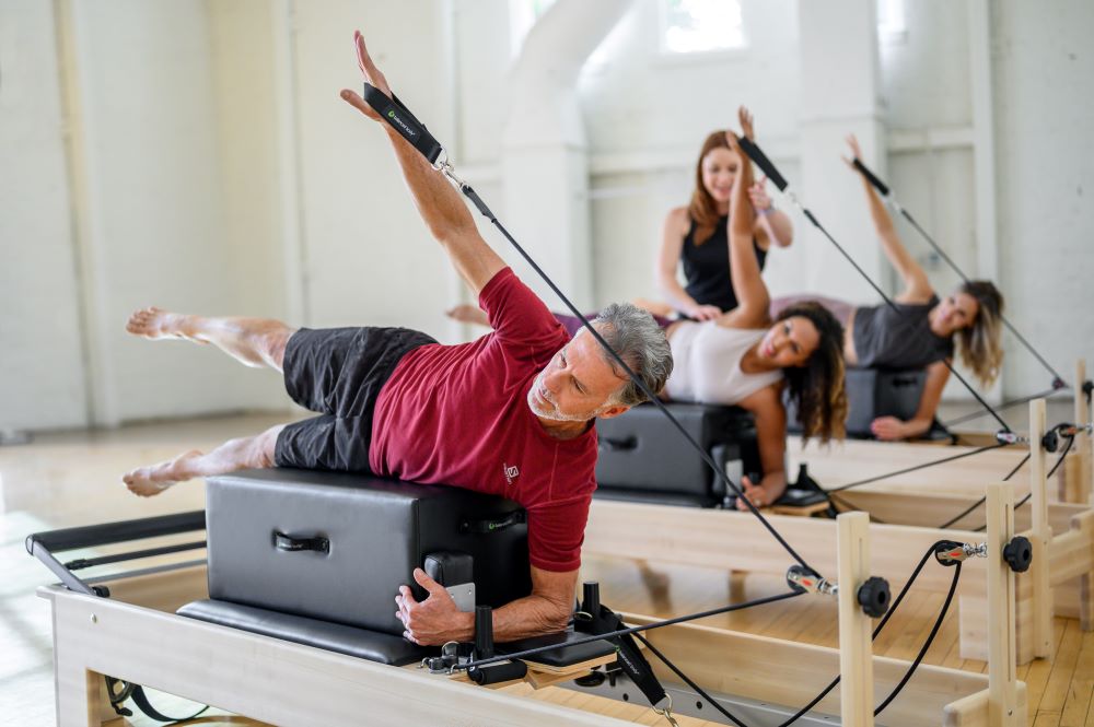 Pilates class using New York Sitting Box on Reformers in studio.