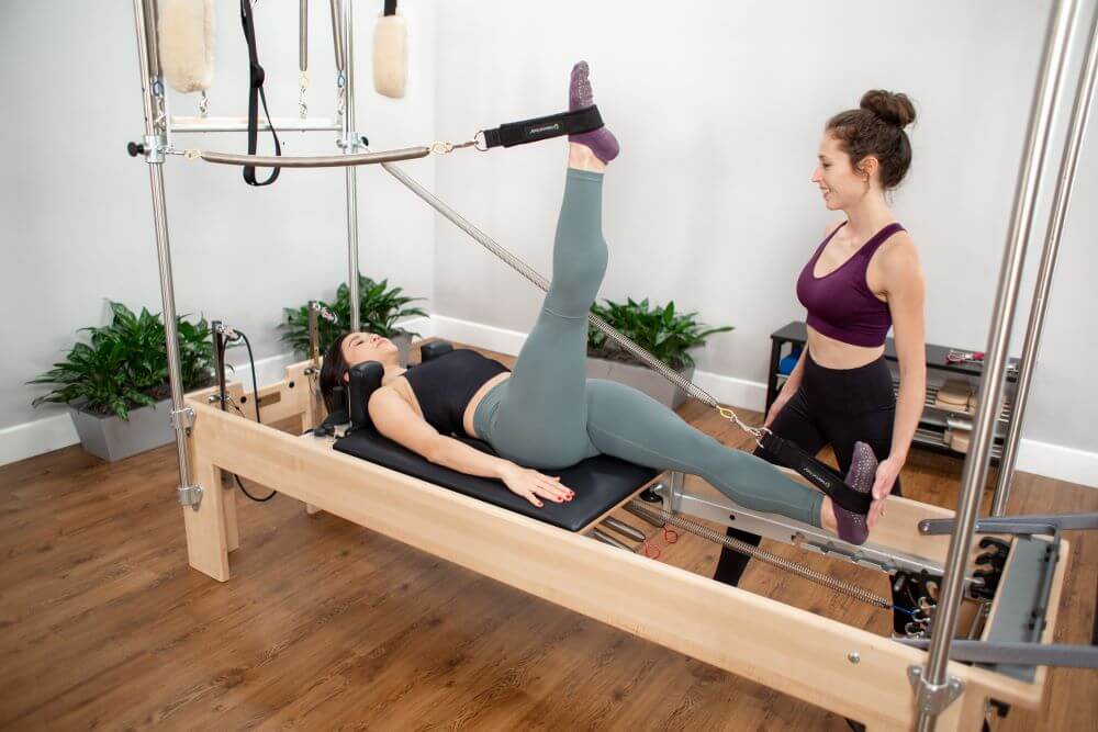 Pilates Reformer Trapeze Combination in use at a studio.