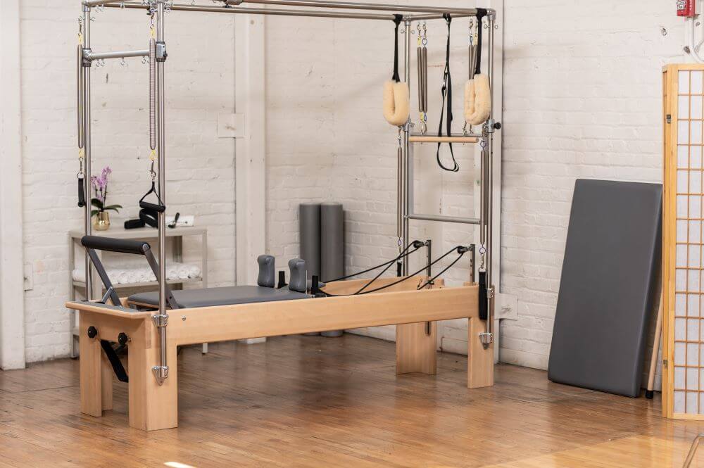 Pilates Reformer Trapeze Combination in small studio setup