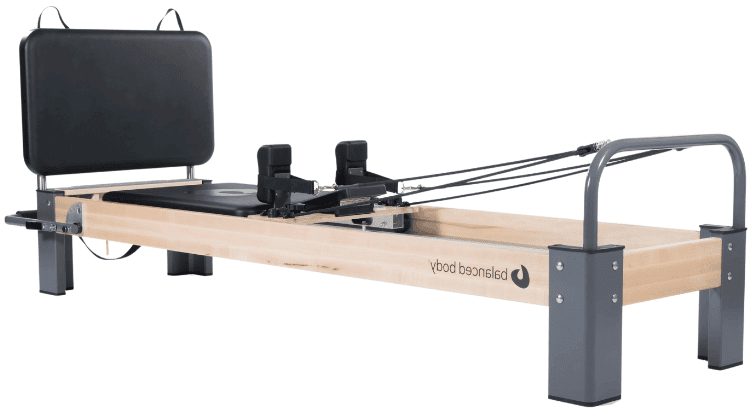 Professional Pilates reformer for versatile dynamic training.