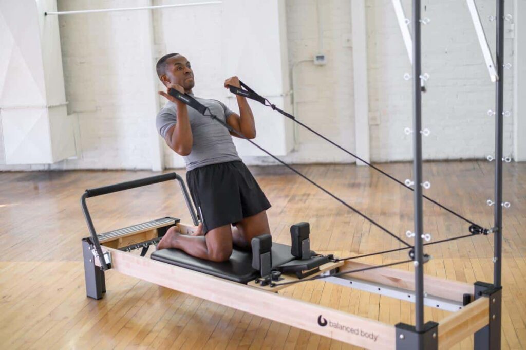 Man using Balanced Body Single Loops on Pilates reformer.