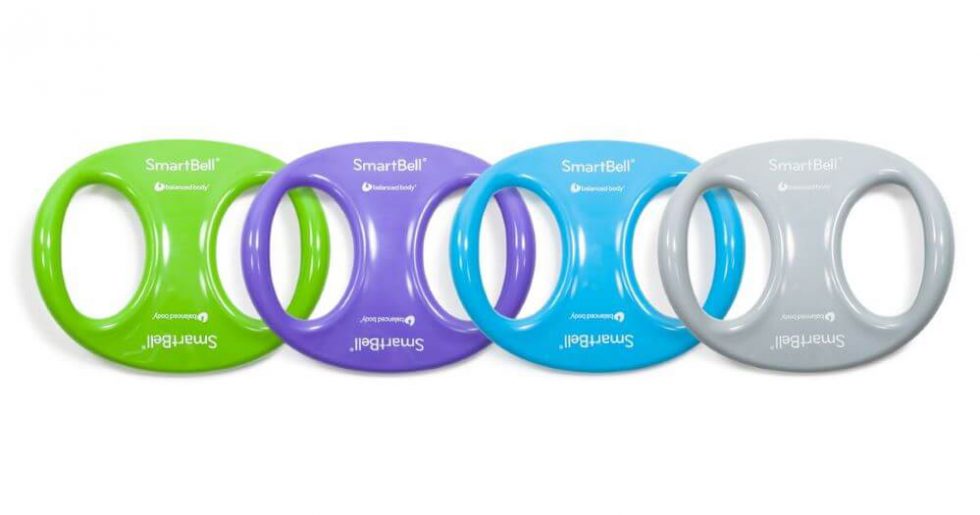 SmartBell training tools in green, purple, blue, and grey for Pilates.