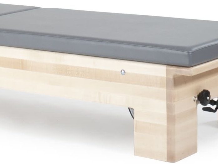 Twin mats for reformer conversion with black upholstery.