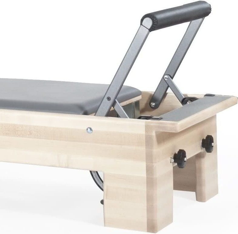 Maple-wood Pilates frame with adjustable components and satin finish.