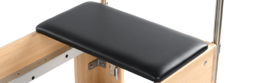 Black vinyl padded head-end mount for Reformer with strap.