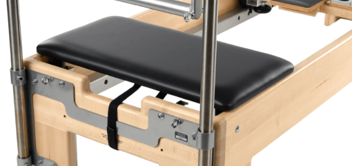 Pilates Studio Reformer with Tower attachment, spring-resistant design.