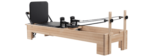 Pilates Studio Reformer with padded jump board for comfort and safety.