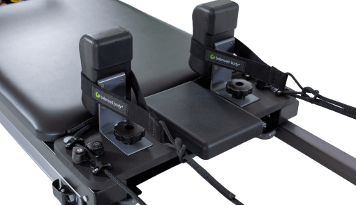 Pilates Carriage with customized 8-wheel system and black vinyl padding