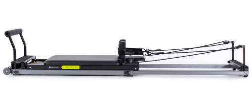 Elegant Pilates reformer frame in anodised aluminum with telescopic tracks.