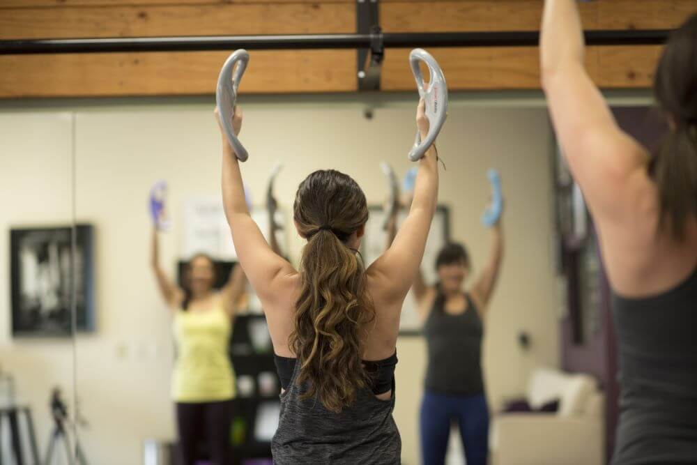 People using Balanced Body SmartBell during a Pilates class.