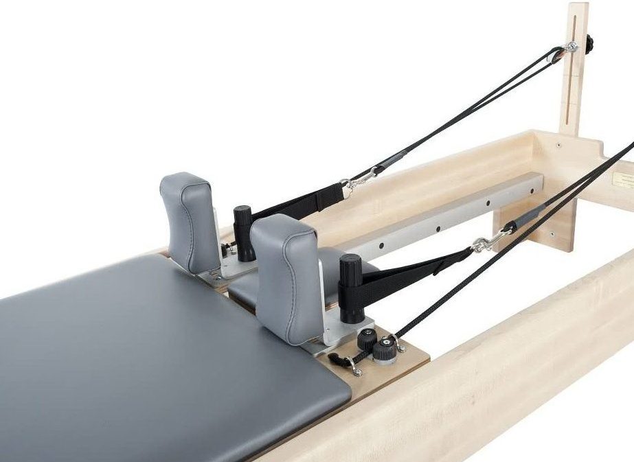 Pilates reformer carriage with TwistLock shoulder rests.