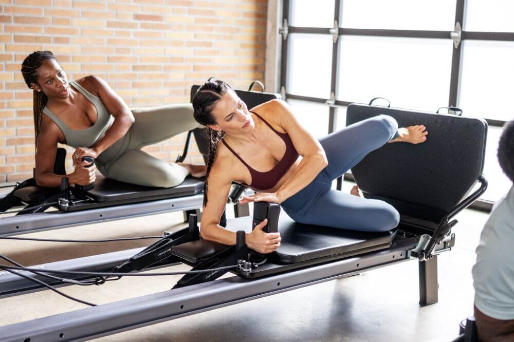 Pilates practitioners using Allegro NextGen Reformer Jumpboard.
