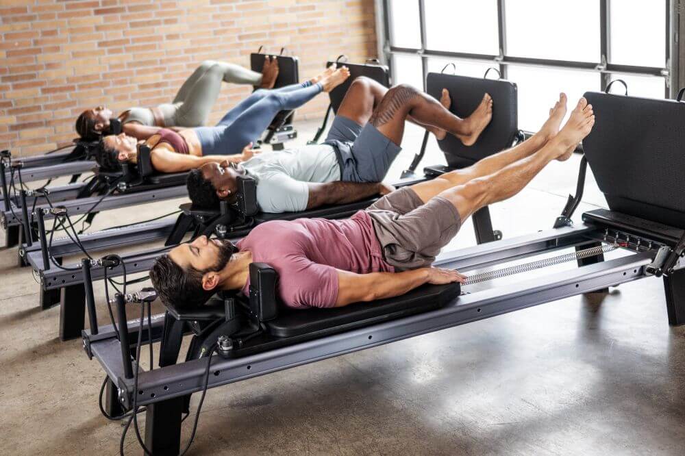 Individuals using Allegro Nextgen Reformers with Jumpboards.